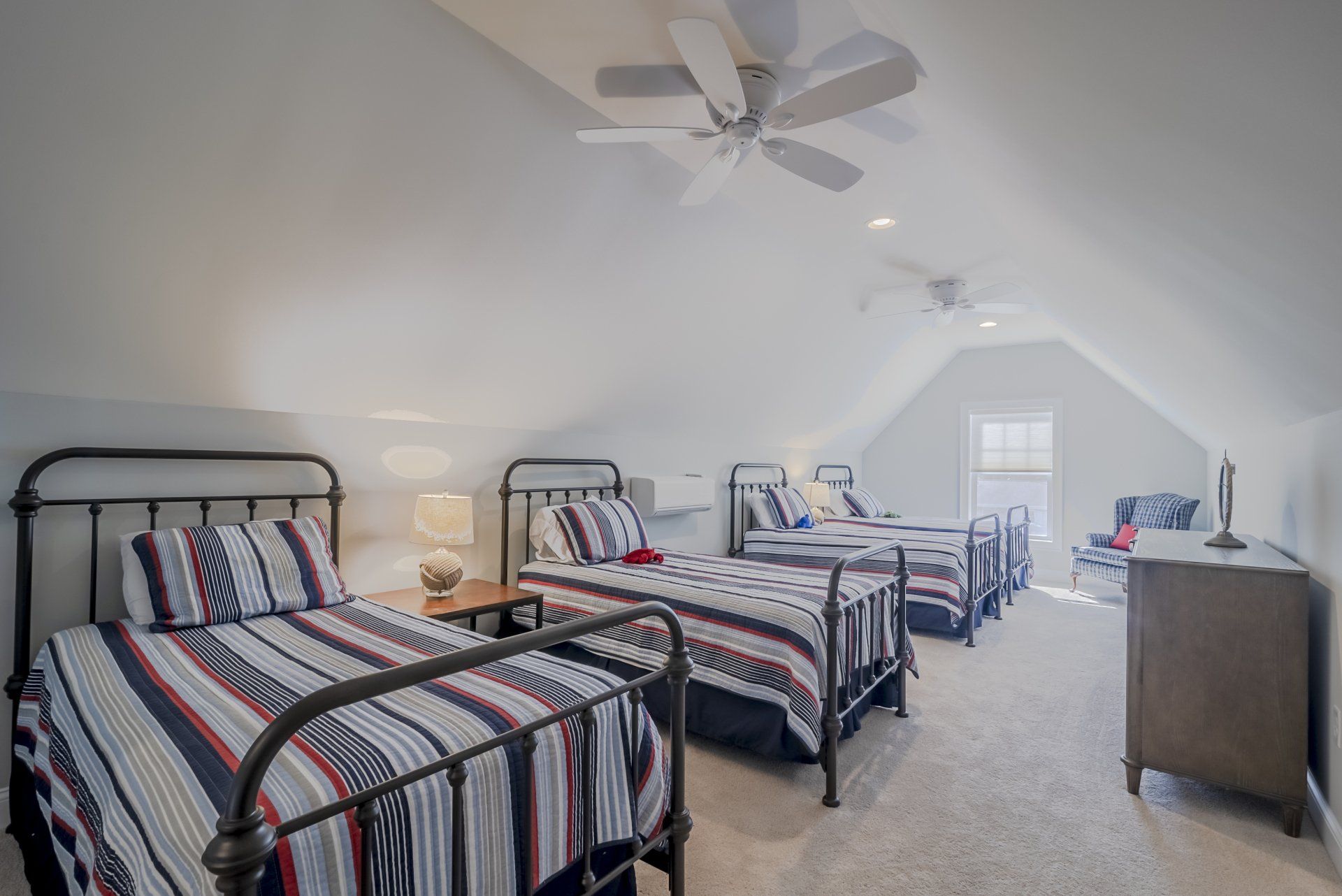Bedroom with beds and vaulted ceiling | Bay to Beach Builders | Greenwood, DE 19950