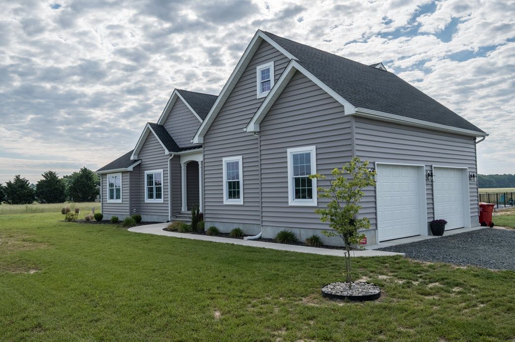 Grey home exterior with garage detail | Garages | Bay to Beach Builders | Greenwood, DE 19950
