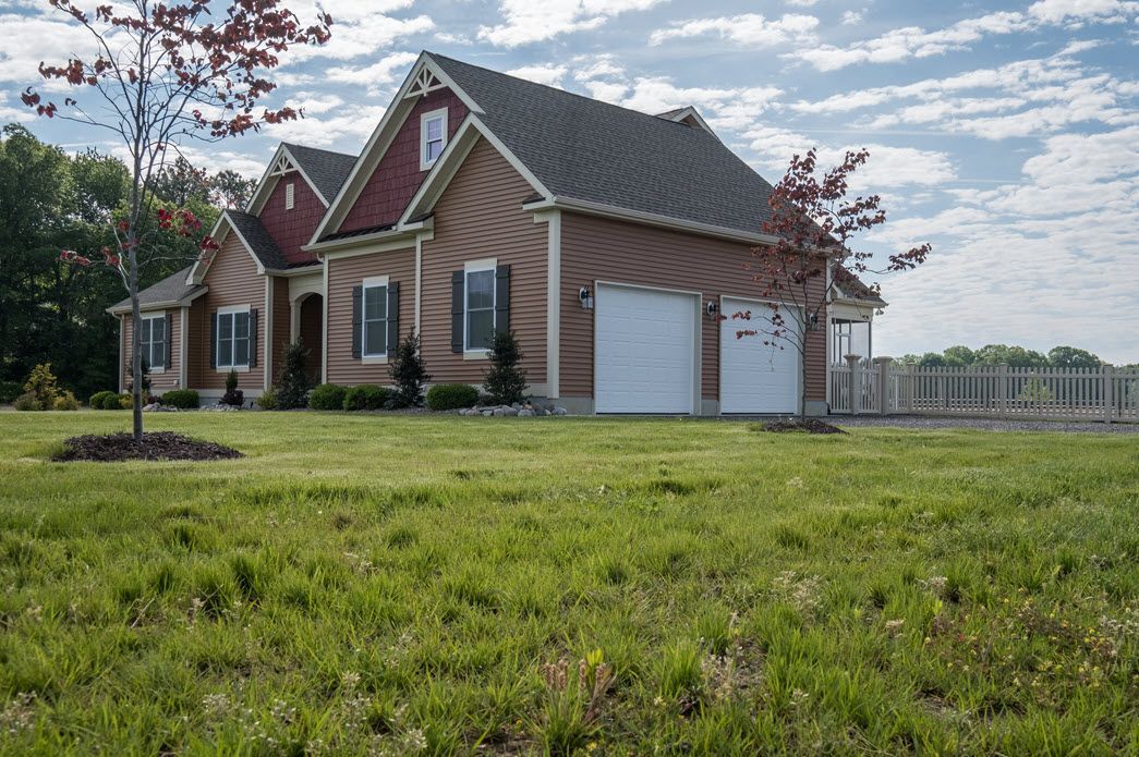 Brown home exterior with garage detail | Garages | Bay to Beach Builders | Greenwood, DE 19950