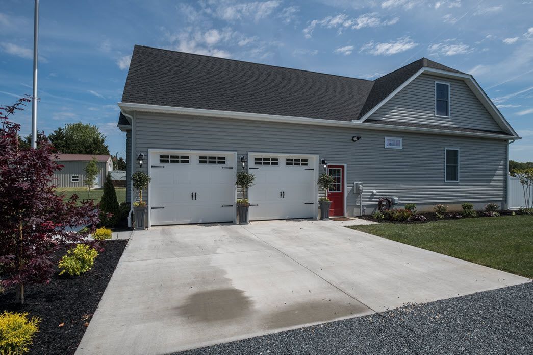 Grey home exterior with garage detail | Garages | Bay to Beach Builders | Greenwood, DE 19950