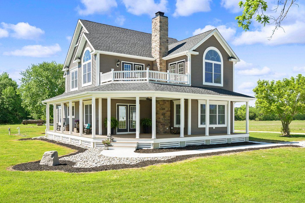 brown home exterior with brick | Exteriors | Bay to Beach Builders | Greenwood, DE 19950