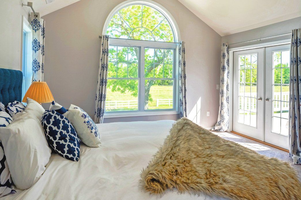 Bedroom with bed and vaulted ceiling | Bay to Beach Builders | Greenwood, DE 19950