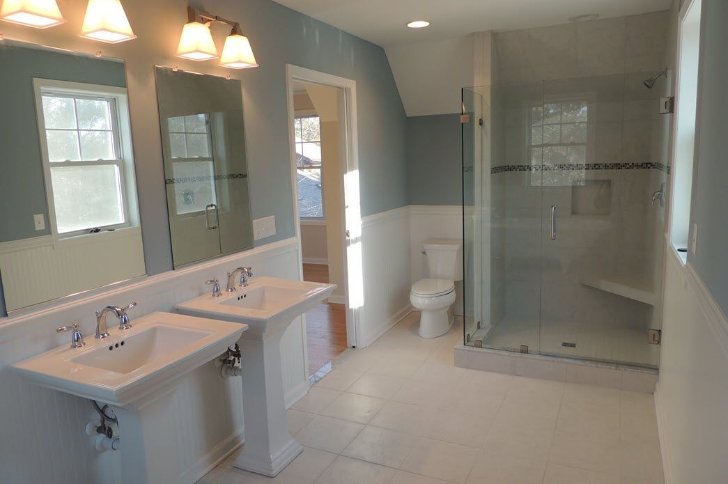 Bathroom with white pedestal sinks | bathrooms | Bay to Beach Builders | Greenwood, DE 19950