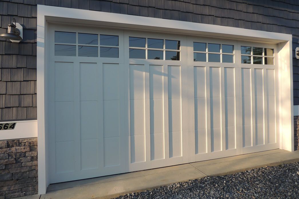 Grey home exterior with garage detail | Garages | Bay to Beach Builders | Greenwood, DE 19950