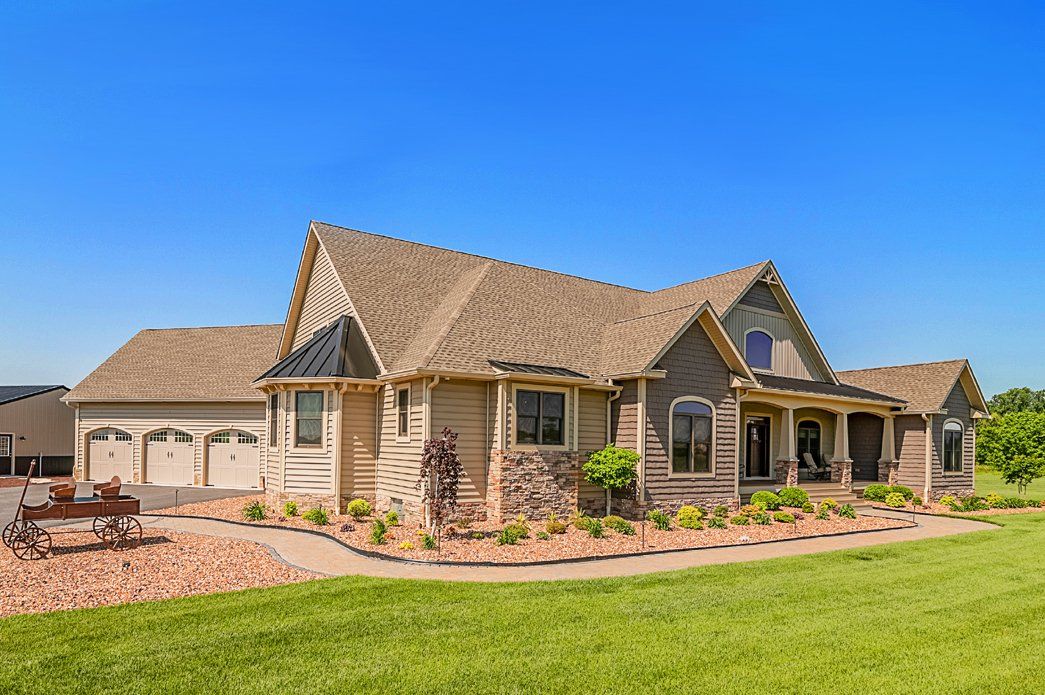 Brown stone home exterior | Exteriors | Bay to Beach Builders | Greenwood, DE 19950