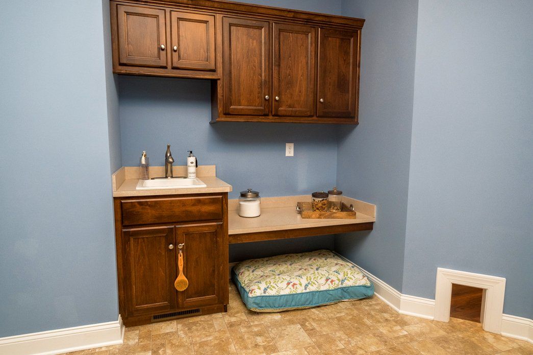 Utility room with cabinetry and sink | Interiors | Bay to Beach Builders | Greenwood, DE 19950