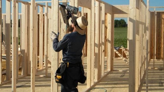 Craftsmanship That Lasts The Durability Of Amish Built Homes   Man Assembling House Frames 1920w 