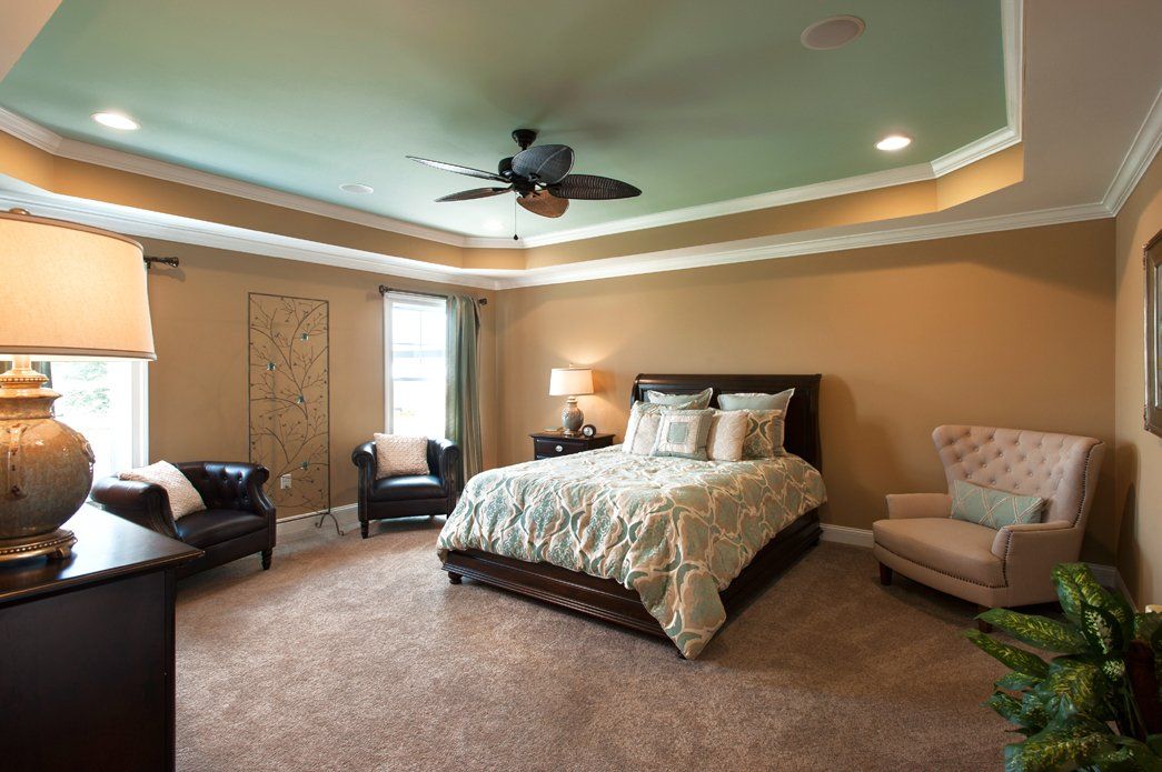 Master bedroom with bed and ceiling treatment | Bay to Beach Builders | Greenwood, DE 19950