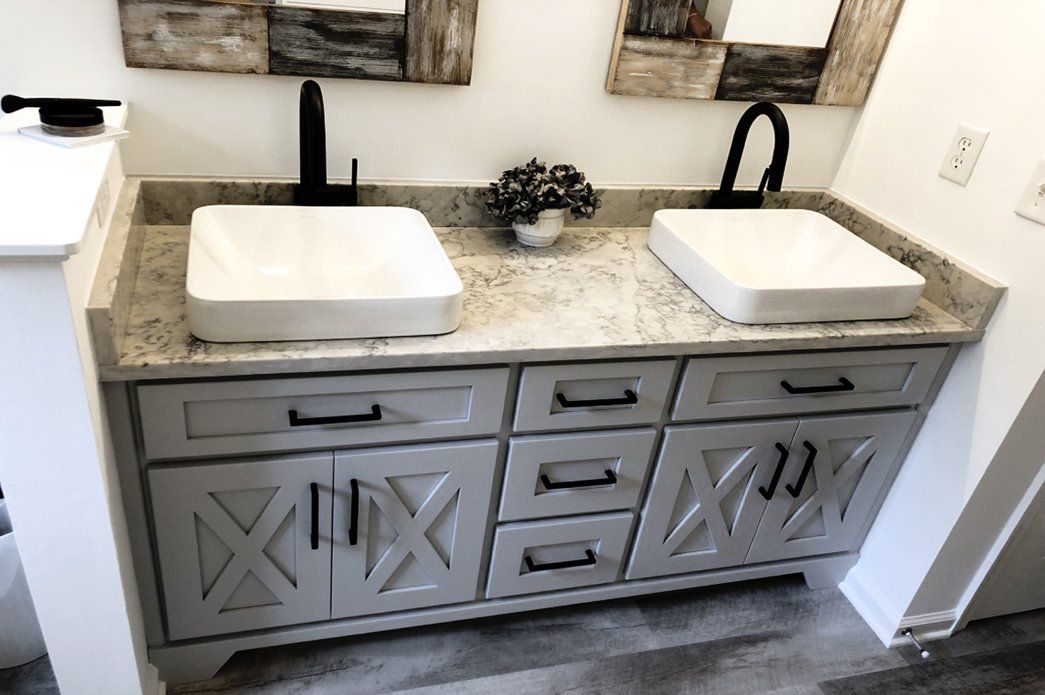 Farmhouse style bathroom vanity with white sinks | Bay to Beach Builders | Greenwood, DE 19950