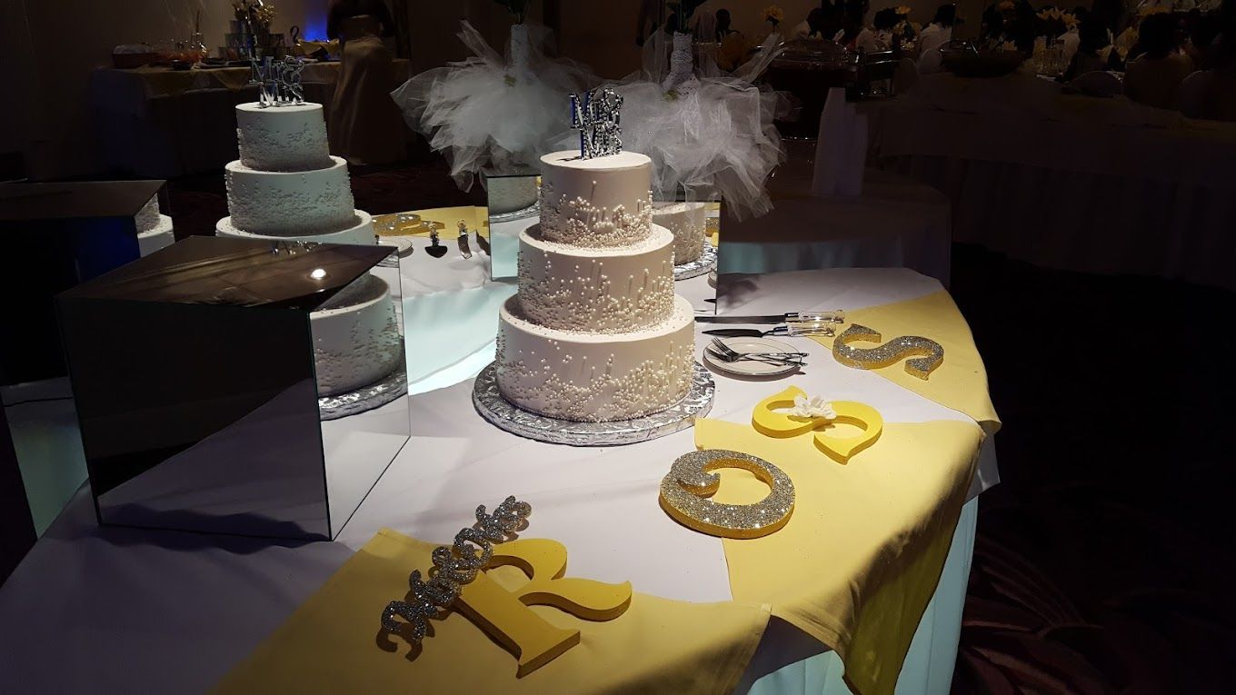 A table with a cake and a sign that says 50