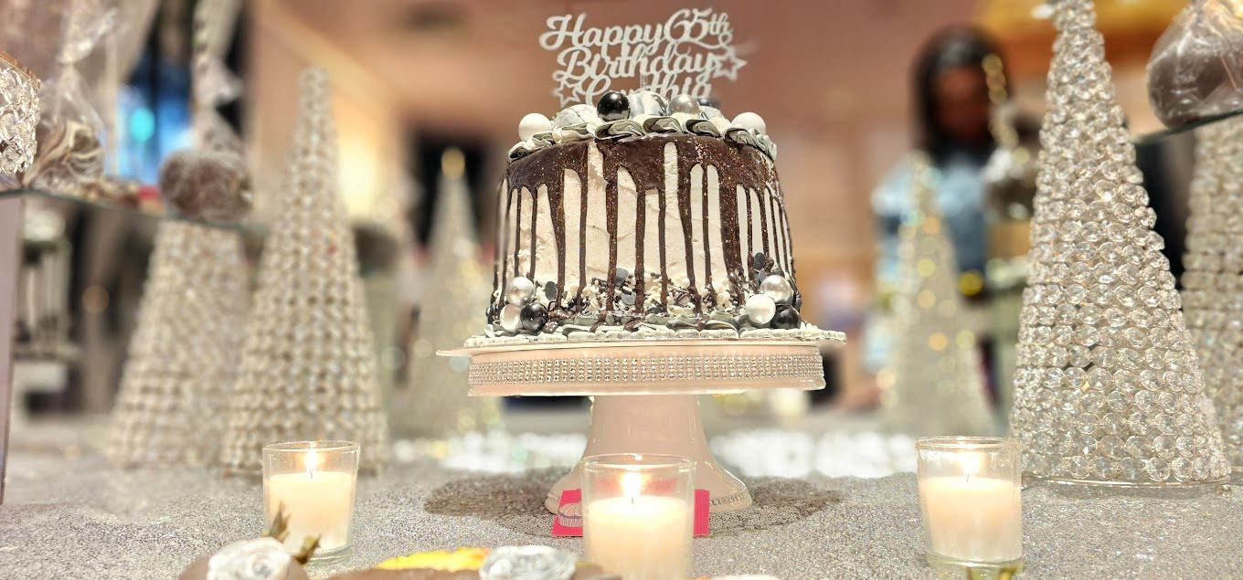 A birthday cake is sitting on top of a table with candles