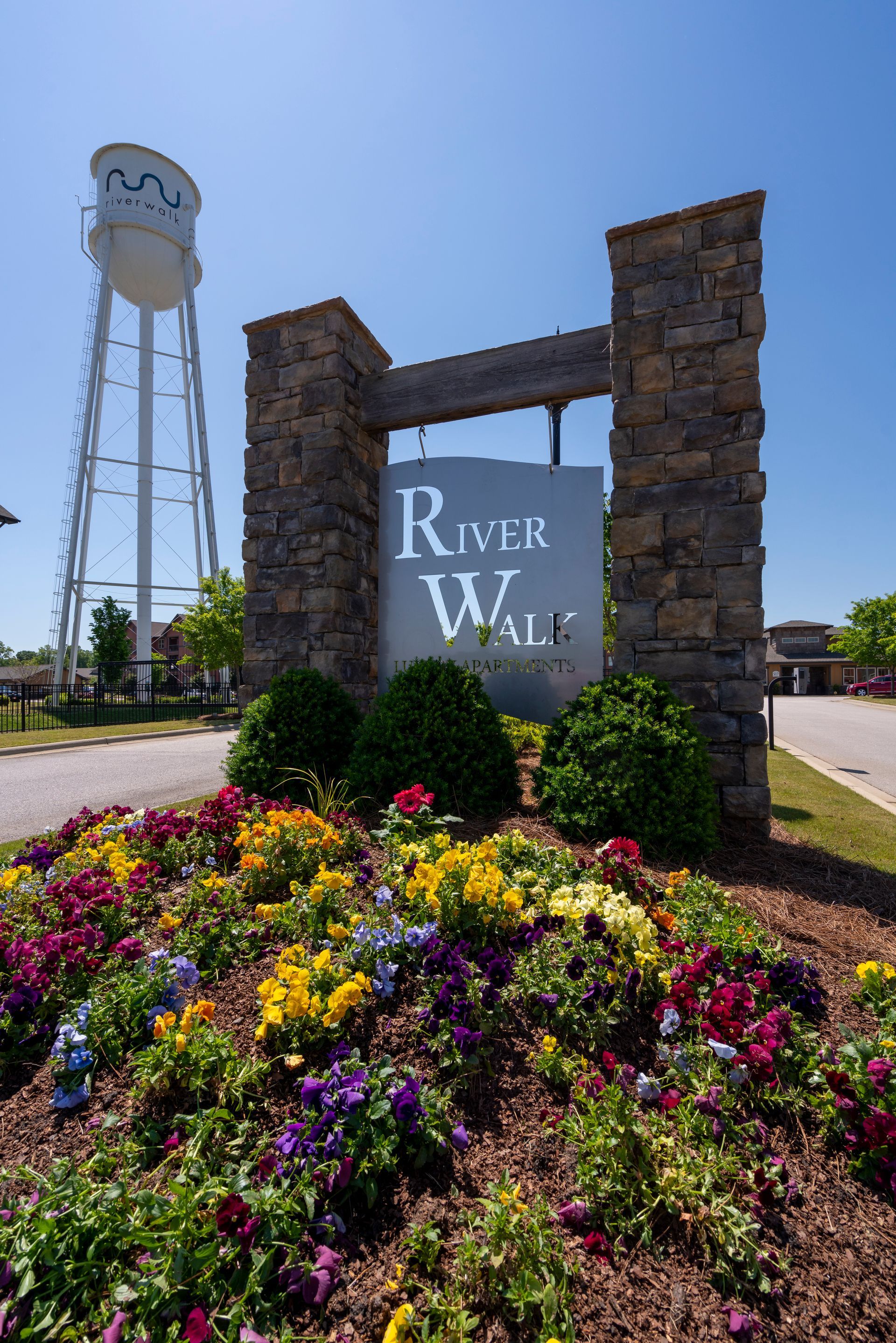 A stone entrance sign for 