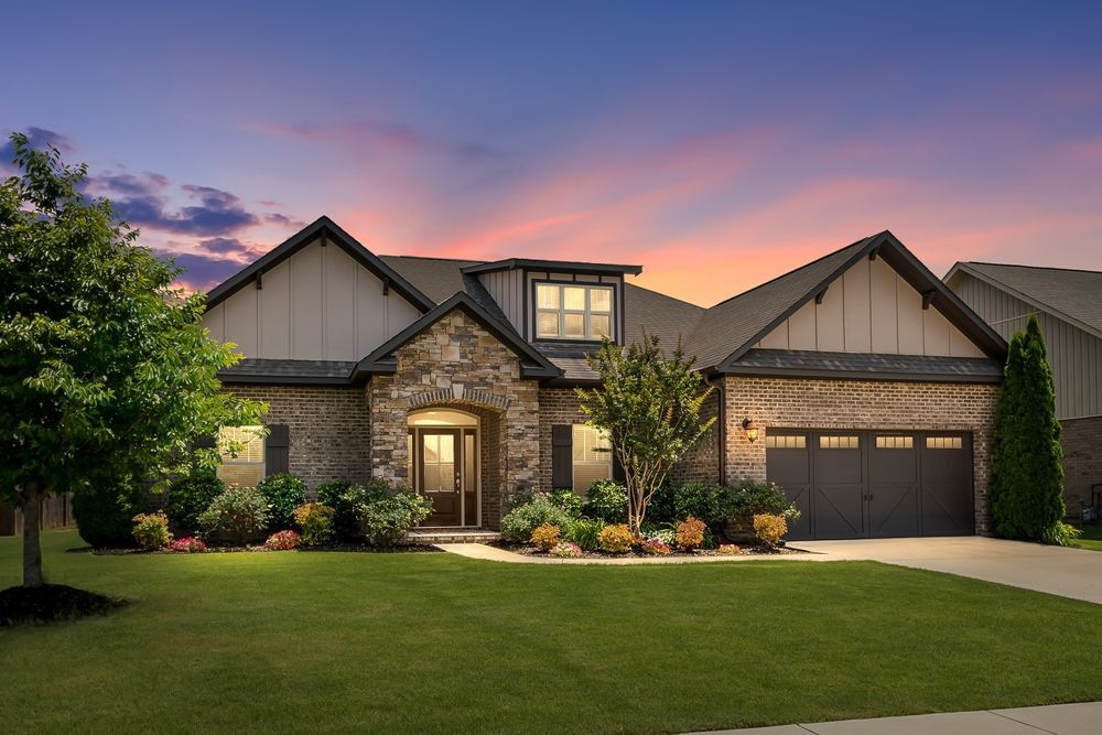 A large house with a large lawn in front of it