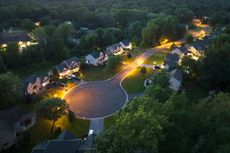 An aerial view of a residential neighborhood at night.