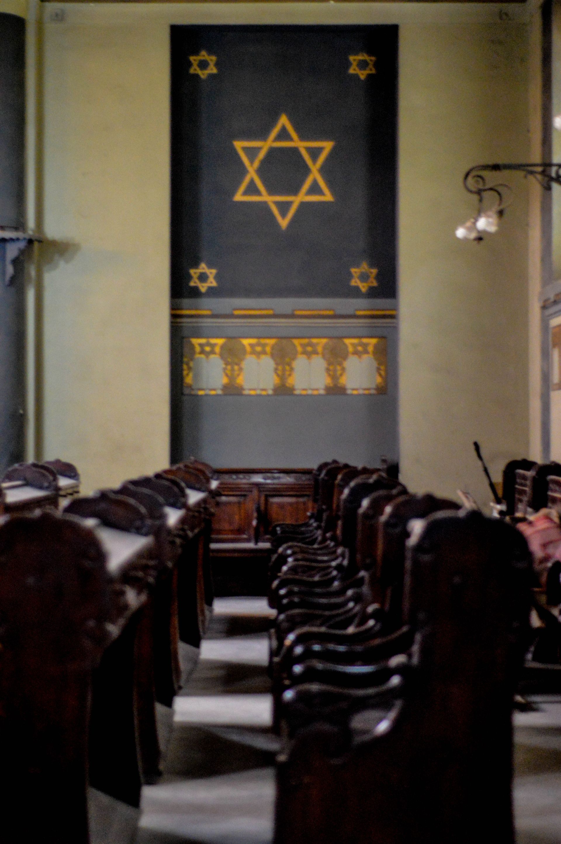 The inside of a synagogue with a star on the wall