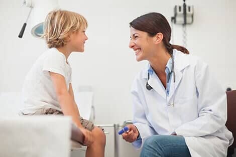 Doctor Treating a Kid — Primary Care Doctor in Aurora, CO
