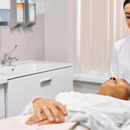 Dentist examining a patient in a bright clinic room