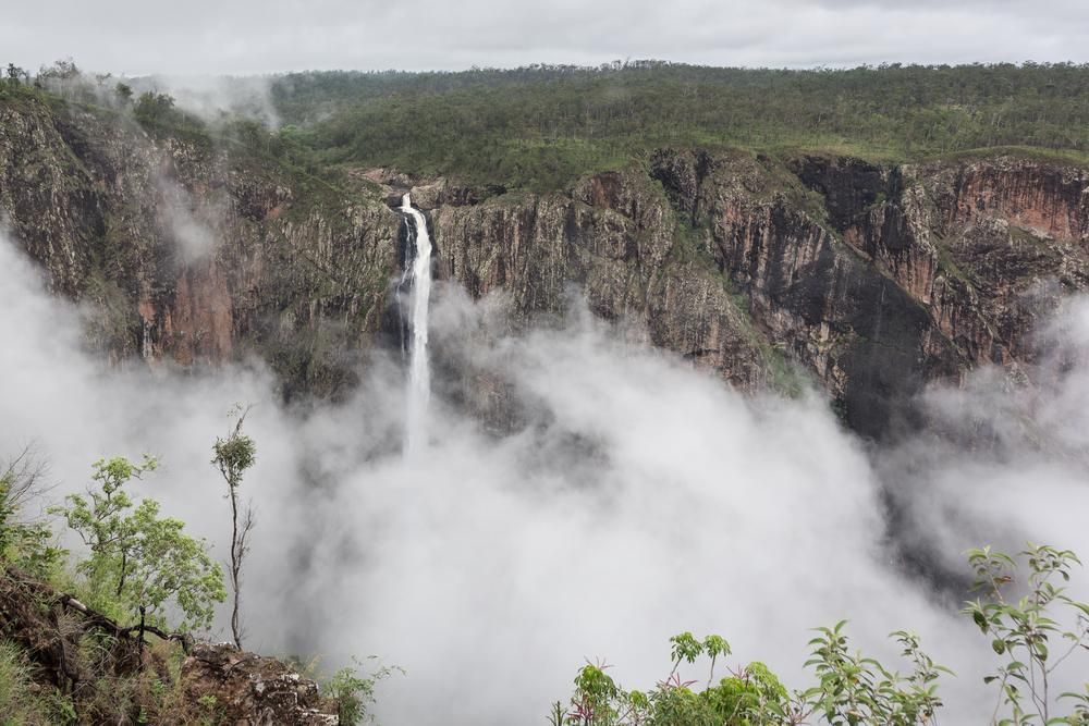 A Waterfall Is Surrounded By Clouds In The Middle Of A Valley — Custom Air In Mount Beauty, NSW
