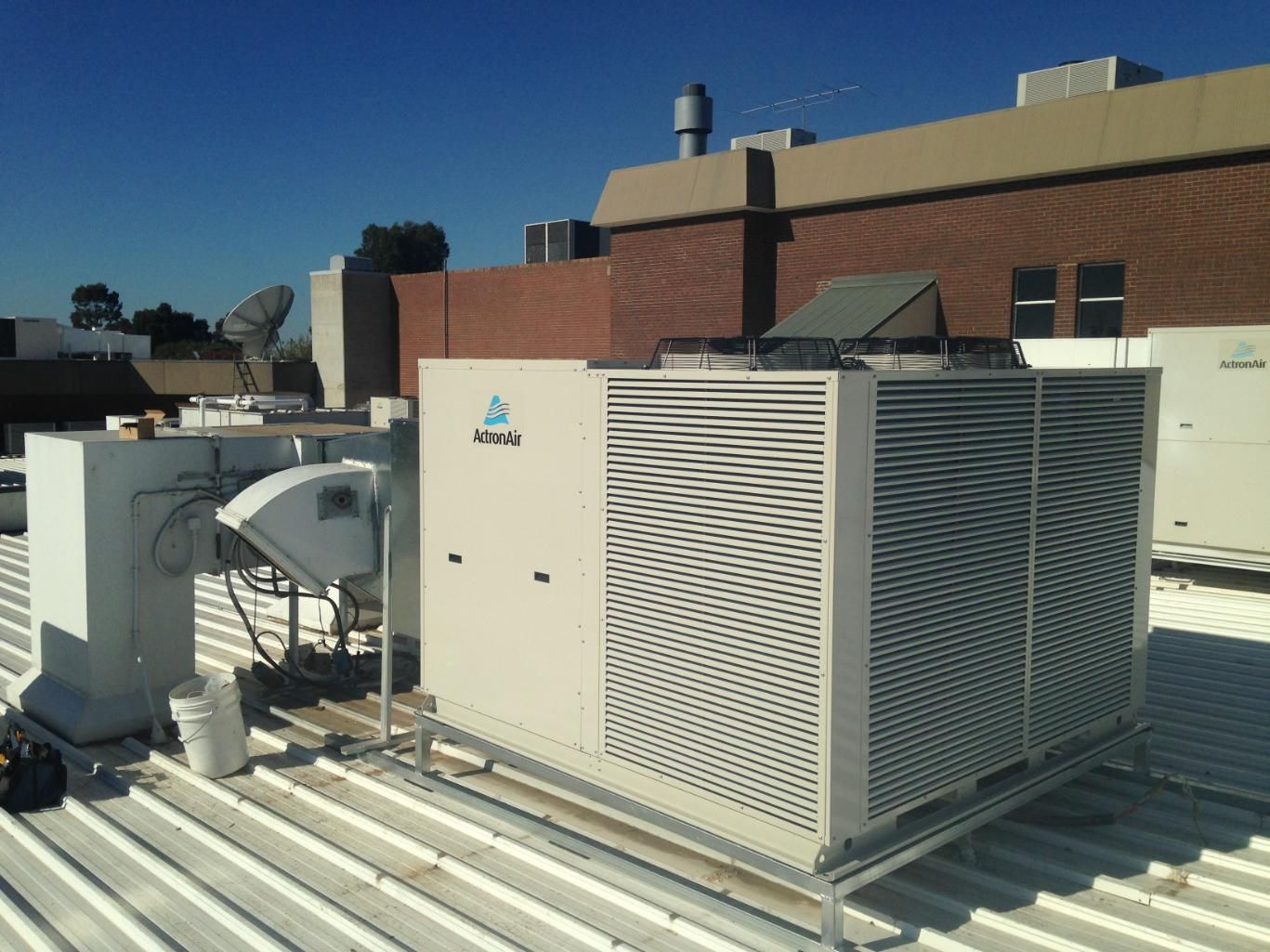 A Large Air Conditioner Is Sitting On The Roof Of A Building — Custom Air In East Albury, NSW