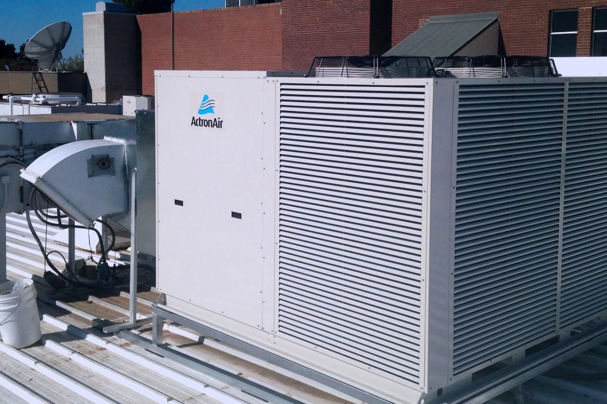 A Large Air Conditioner Is On The Roof Of A Building — Custom Air In East Albury, NSW