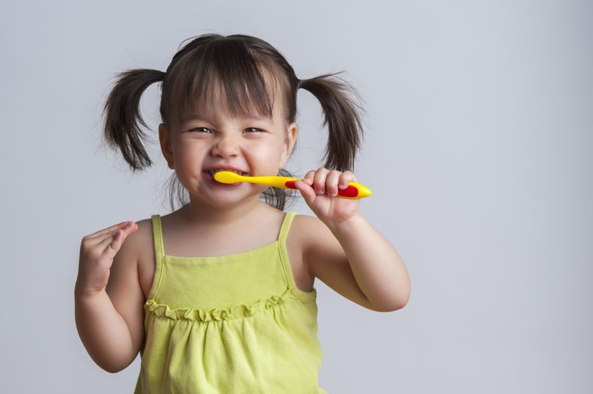 child learning to brush teeth 