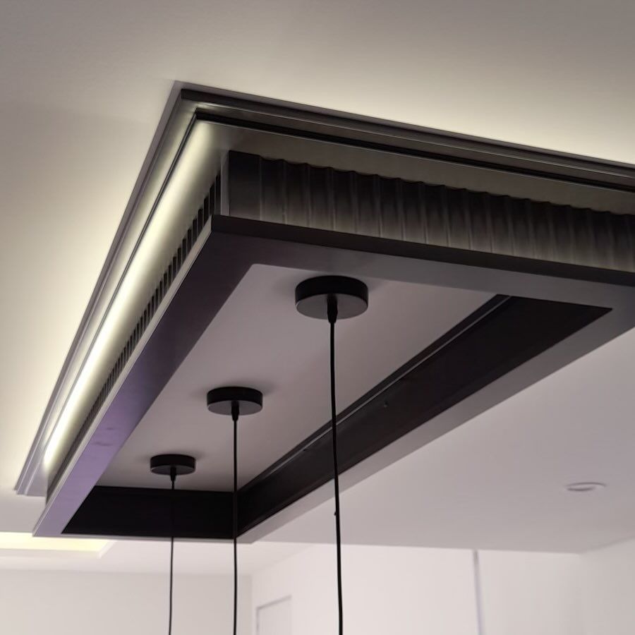 A ceiling with a light hanging from it