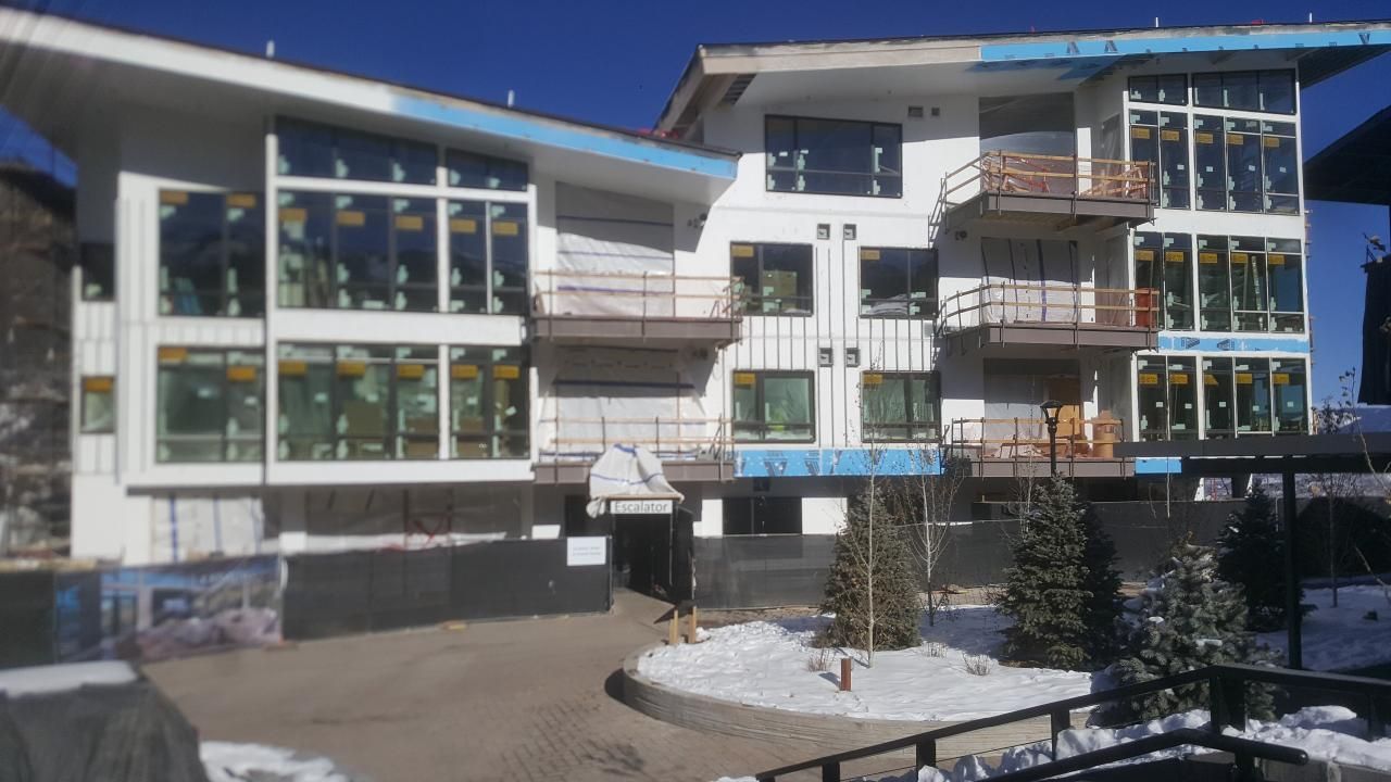 Large building featuring numerous windows and balconies.
