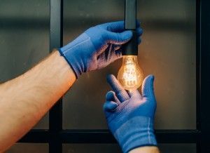 Hand Holding Lightbulb | Richmond, VA | Walker & Frick Construction