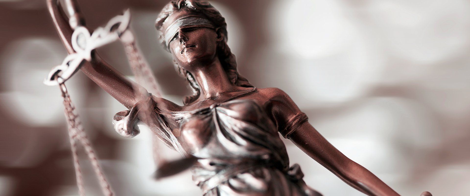 scales of justice held by lady justice