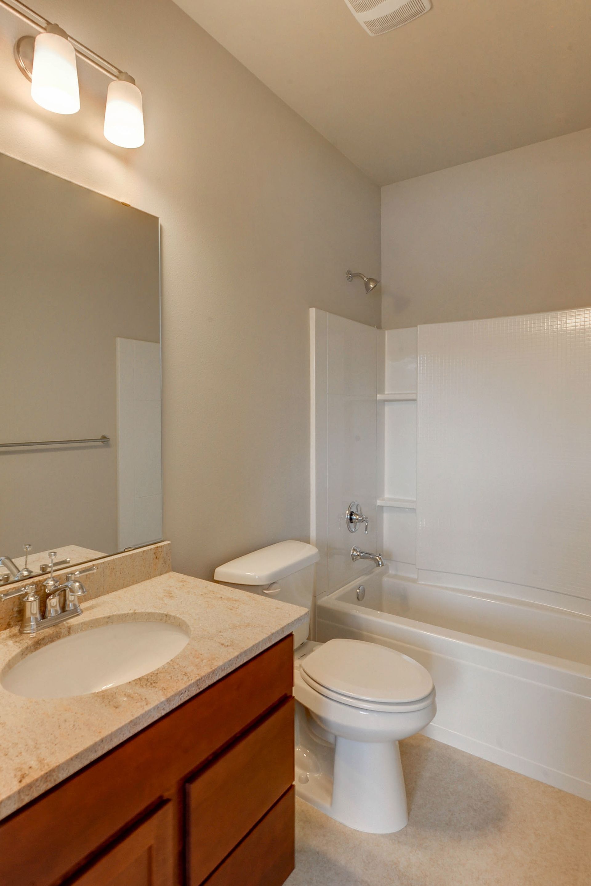 a bathroom with a toilet a sink and a bathtub
