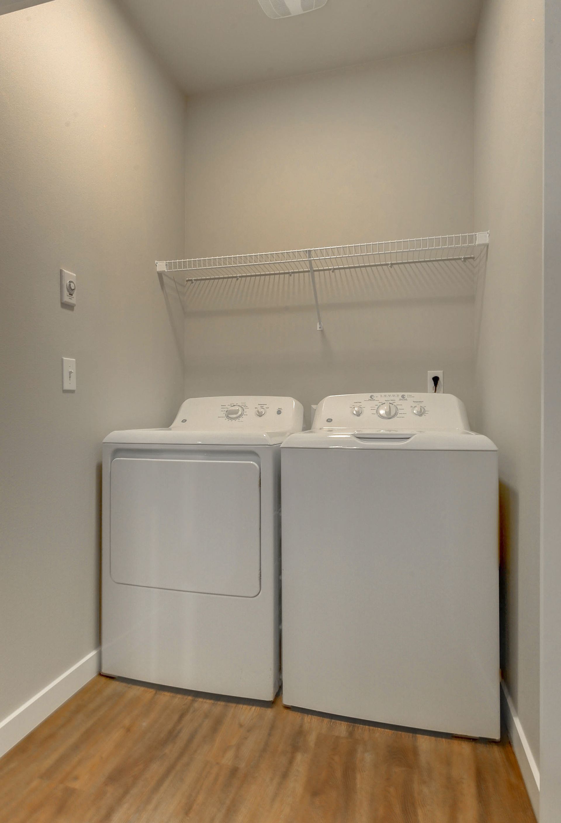 a white washer and dryer in a laundry room