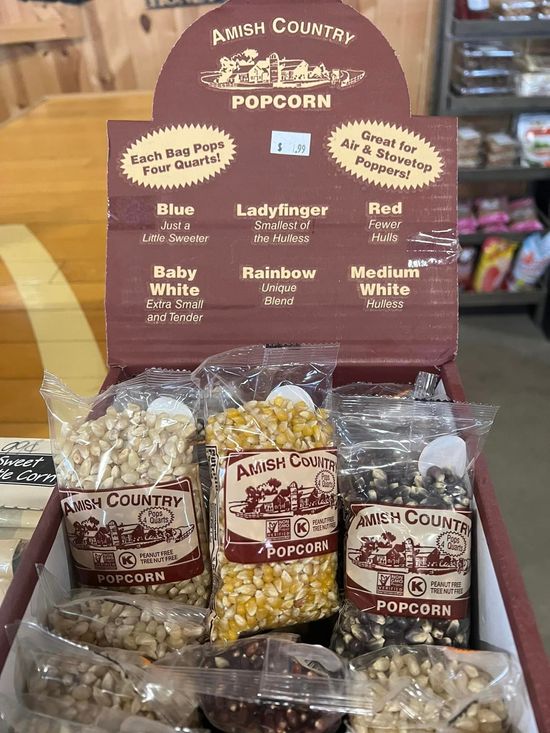 A shelf filled with lots of different types of seeds.