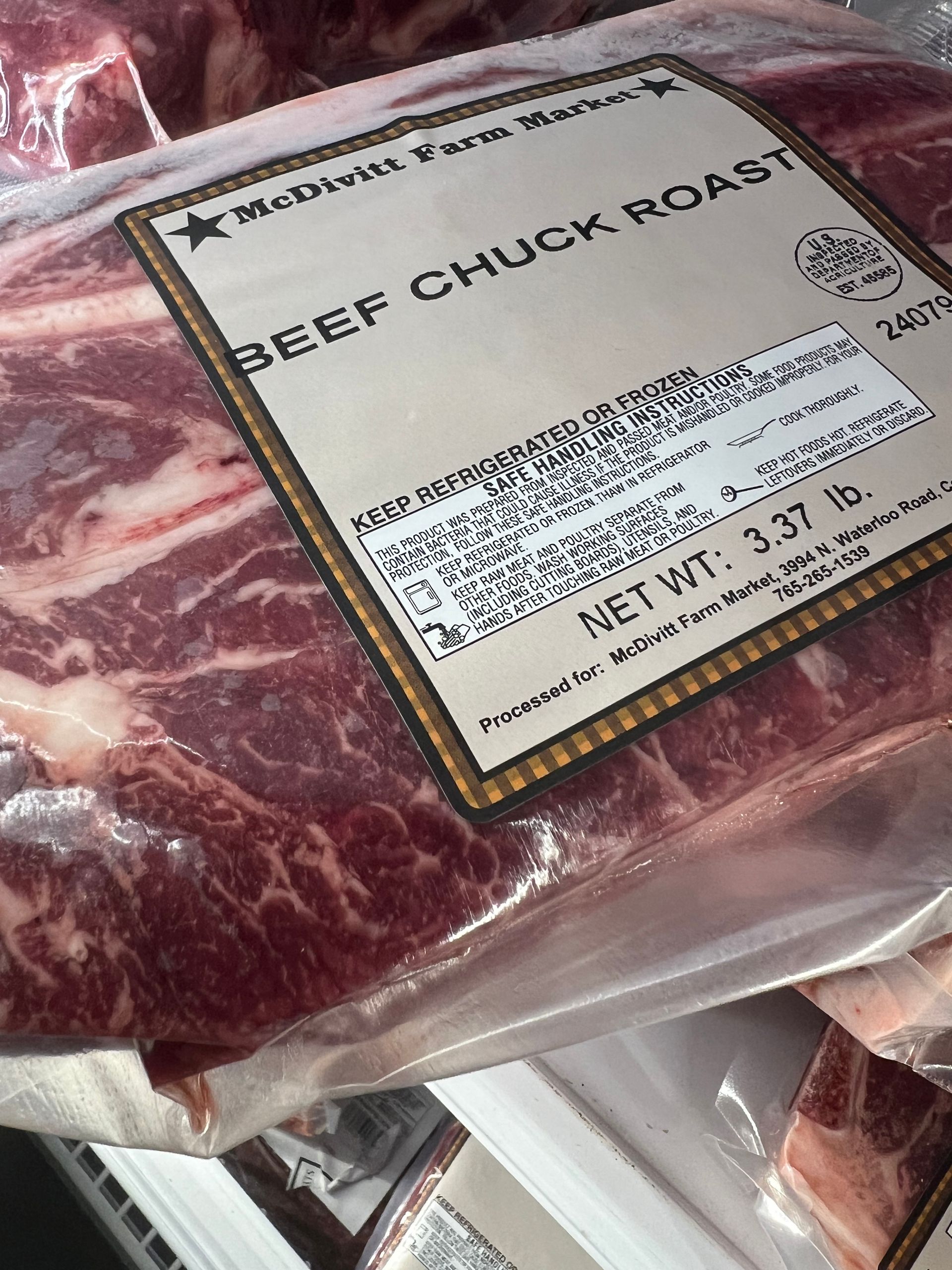A package of beef chuck roast with a label on it