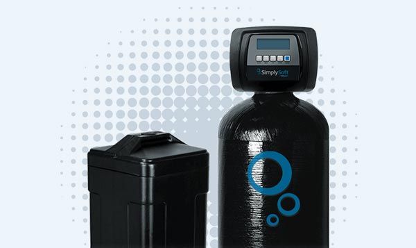 A black water softener is sitting next to a black box on a white background.