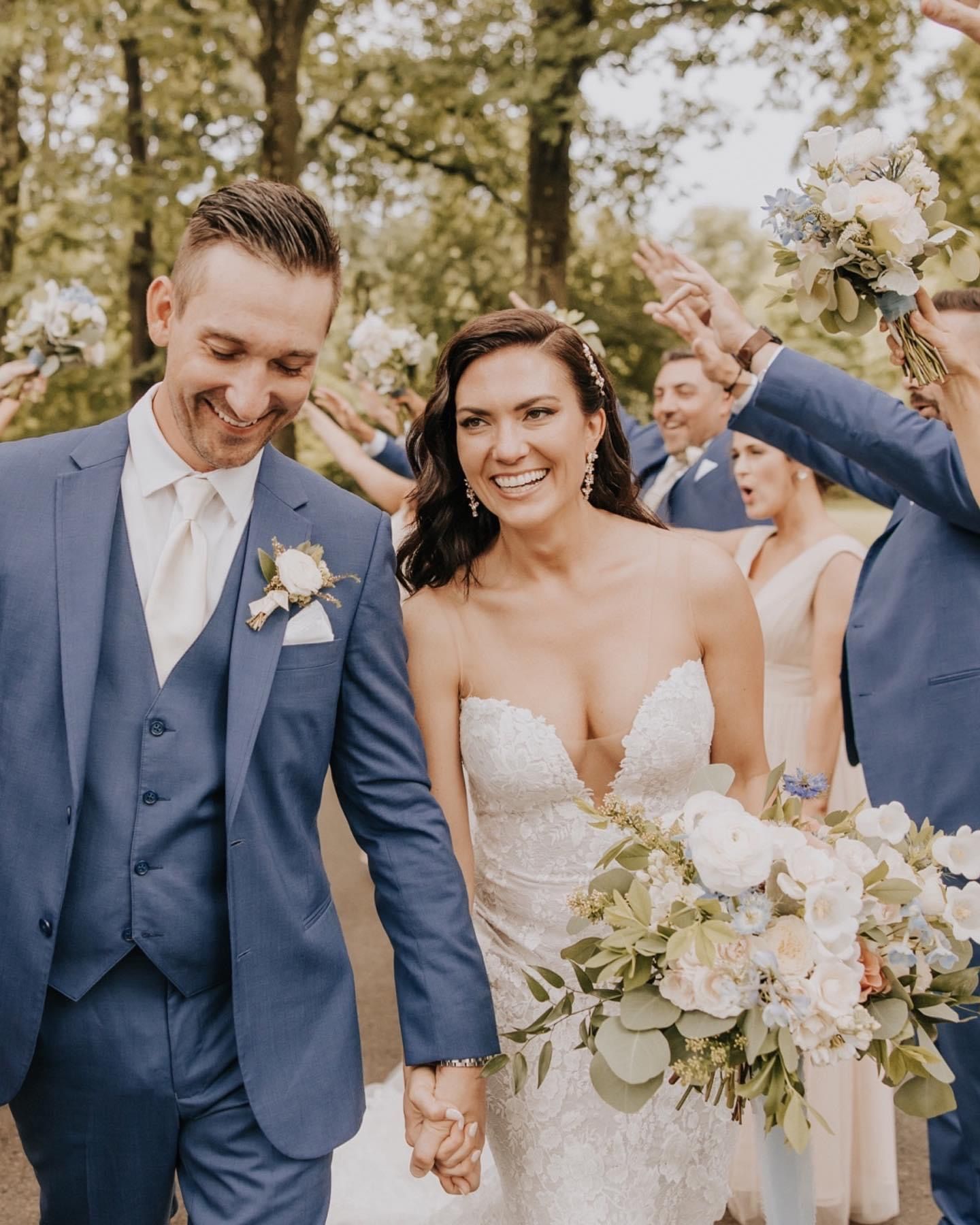 a bride and groom are walking down the aisle holding hands with their wedding party . natural wedding makeup. pittsburgh, pa. bridal makeup. bridal mua. wedding makeup artist. moriah e beauty. emily havranek photography.