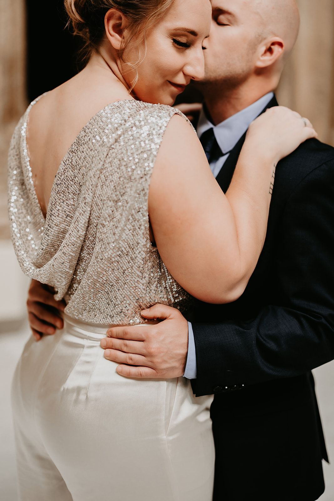 a man in a suit is kissing a woman on the cheek . natural wedding makeup. pittsburgh, pa. bridal makeup. bridal mua. wedding makeup artist. moriah e beauty. drzaga photo.