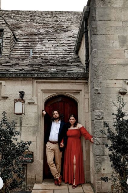 a man and a woman are standing in front of a stone building holding hands . natural wedding makeup. pittsburgh, pa. bridal makeup. bridal mua. wedding makeup artist. moriah e beauty. AMC photography.