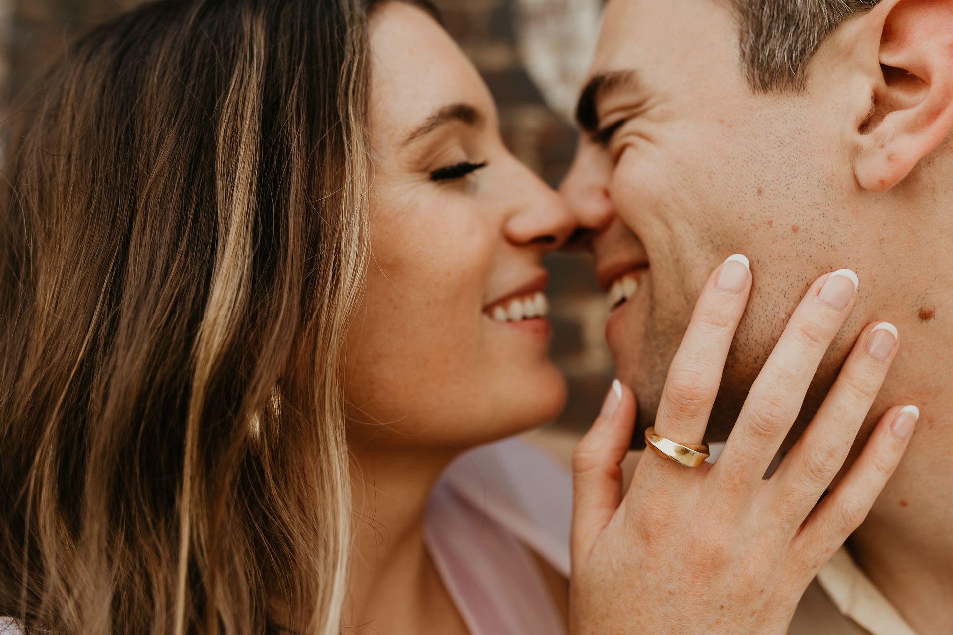a man and a woman are standing next to each other in front of a brick building . natural wedding makeup. pittsburgh, pa. bridal makeup. bridal mua. wedding makeup artist. moriah e beauty. ashley sara photography.