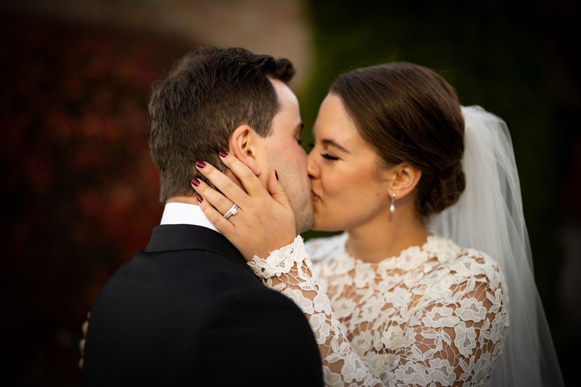 a bride and groom are kissing on their wedding day . natural wedding makeup. pittsburgh, pa. bridal makeup. bridal mua. wedding makeup artist. moriah e beauty. adam michaels photography.