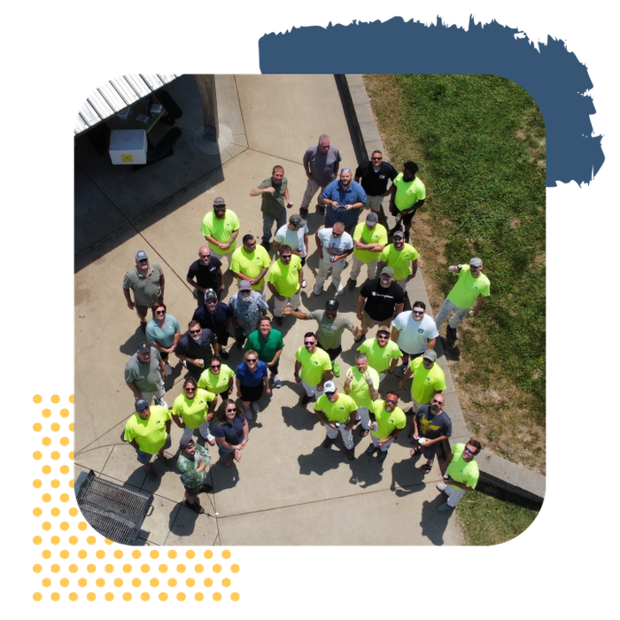 An aerial view of a group of people standing on a sidewalk