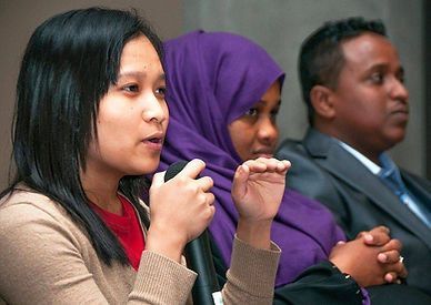 Young Women Speaking on a Forum