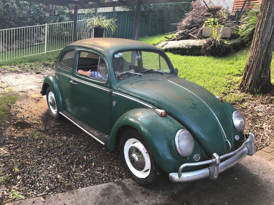 A Green Car is Parked in a Driveway — VR Mechanical in West Gosford, NSW