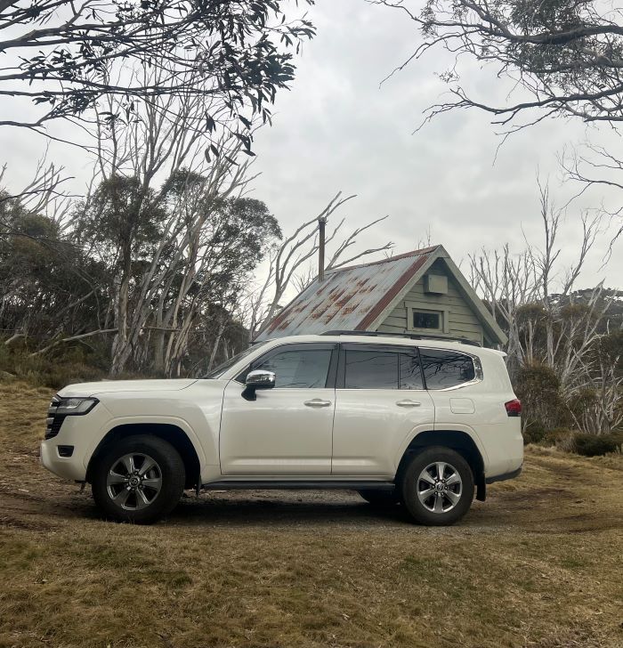 A White Car is Parked in Front of a Small House — VR Mechanical in West Gosford, NSW