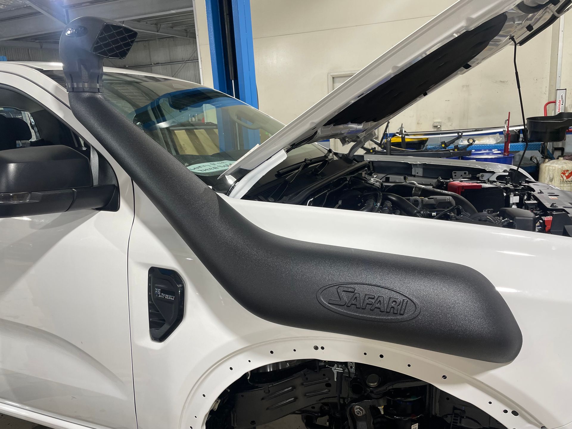 A Black Car is Parked in a Grassy Field — VR Mechanical in West Gosford, NSW