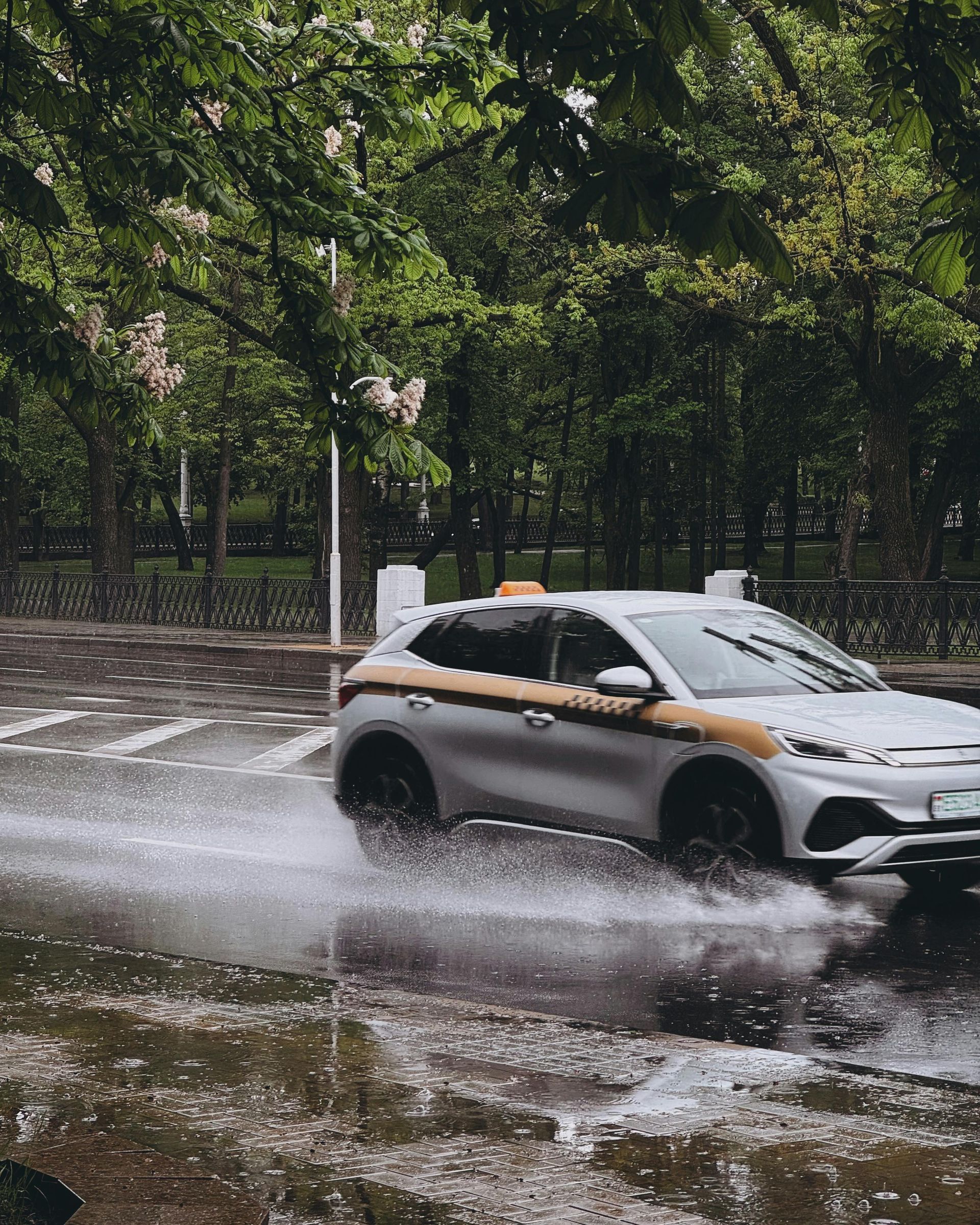 Two business professionals in suits reviewing documents, discussing strategy.