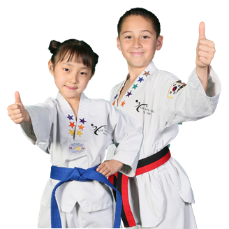 A girl and a boy in taekwondo uniforms are giving thumbs up.