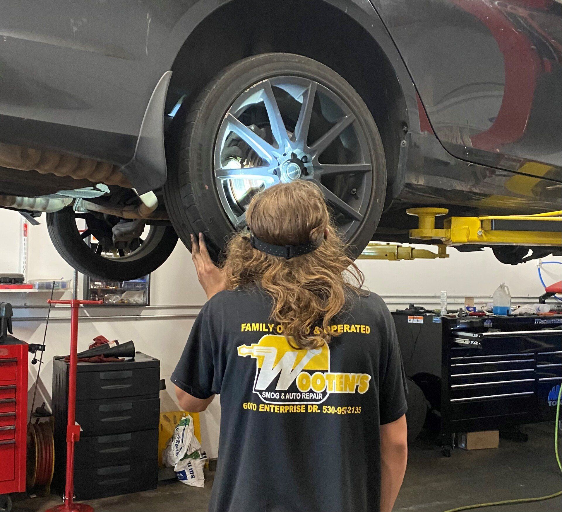 Mechanic Fixing The Disk Brake - Diamond Springs, CA - Wooten's Smog and Auto Repair