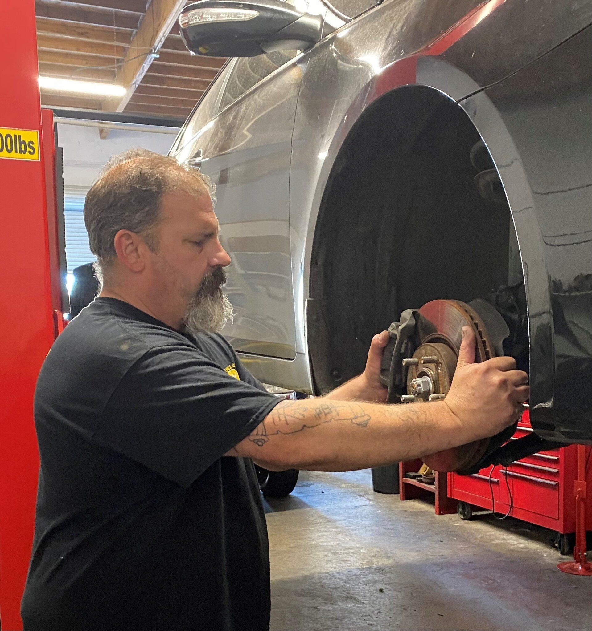Mechanic Checking The Disc Brake - Diamond Springs, CA - Wooten's Smog and Auto Repair