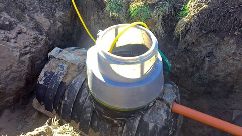 Septic Tank Treatment — Manhole Plastic Cover In The Garden Lawn in Lebanon, TN