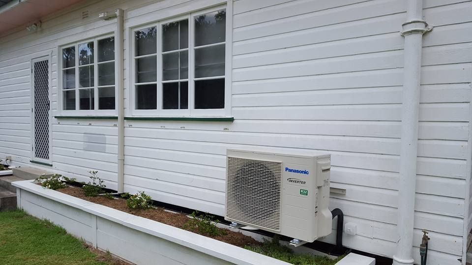 Air condition Attached in the Wall — Electrician in Warwick